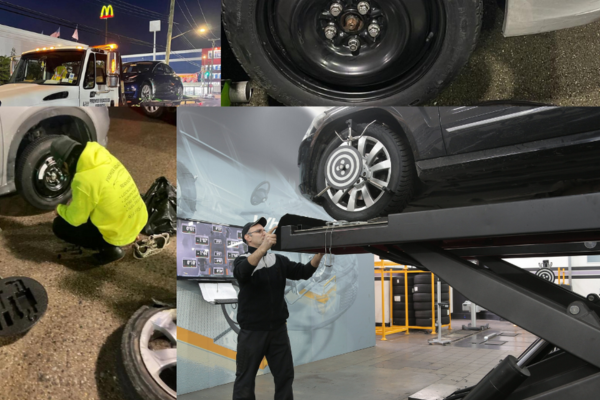 "Roadside assistance: One man changing tire, another loading car onto towing truck."